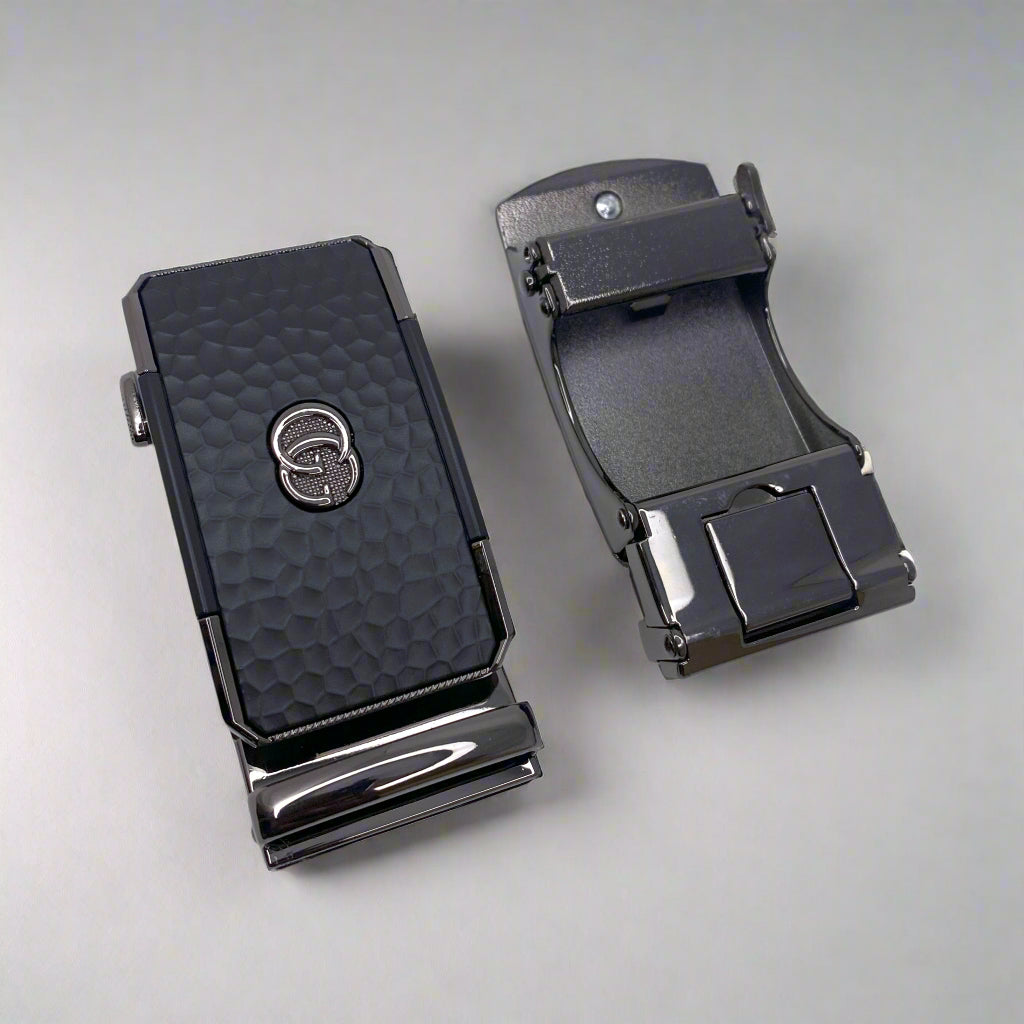 Two black belt buckles on a white background