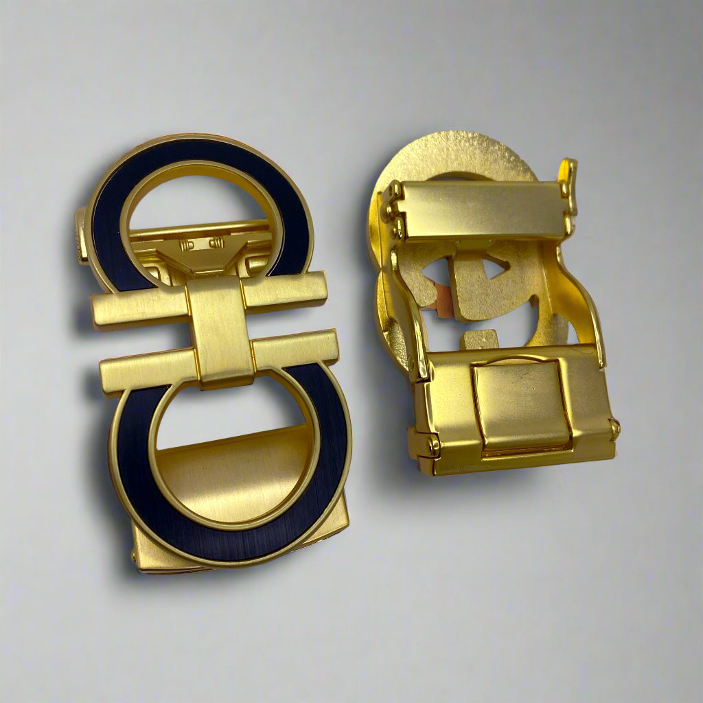 Gold and black earring on a white background